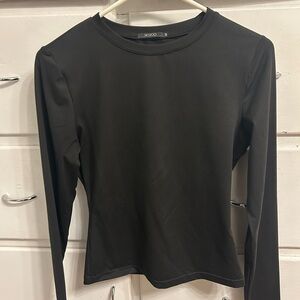 Sleek Black Long Sleeve Top by [Brand]